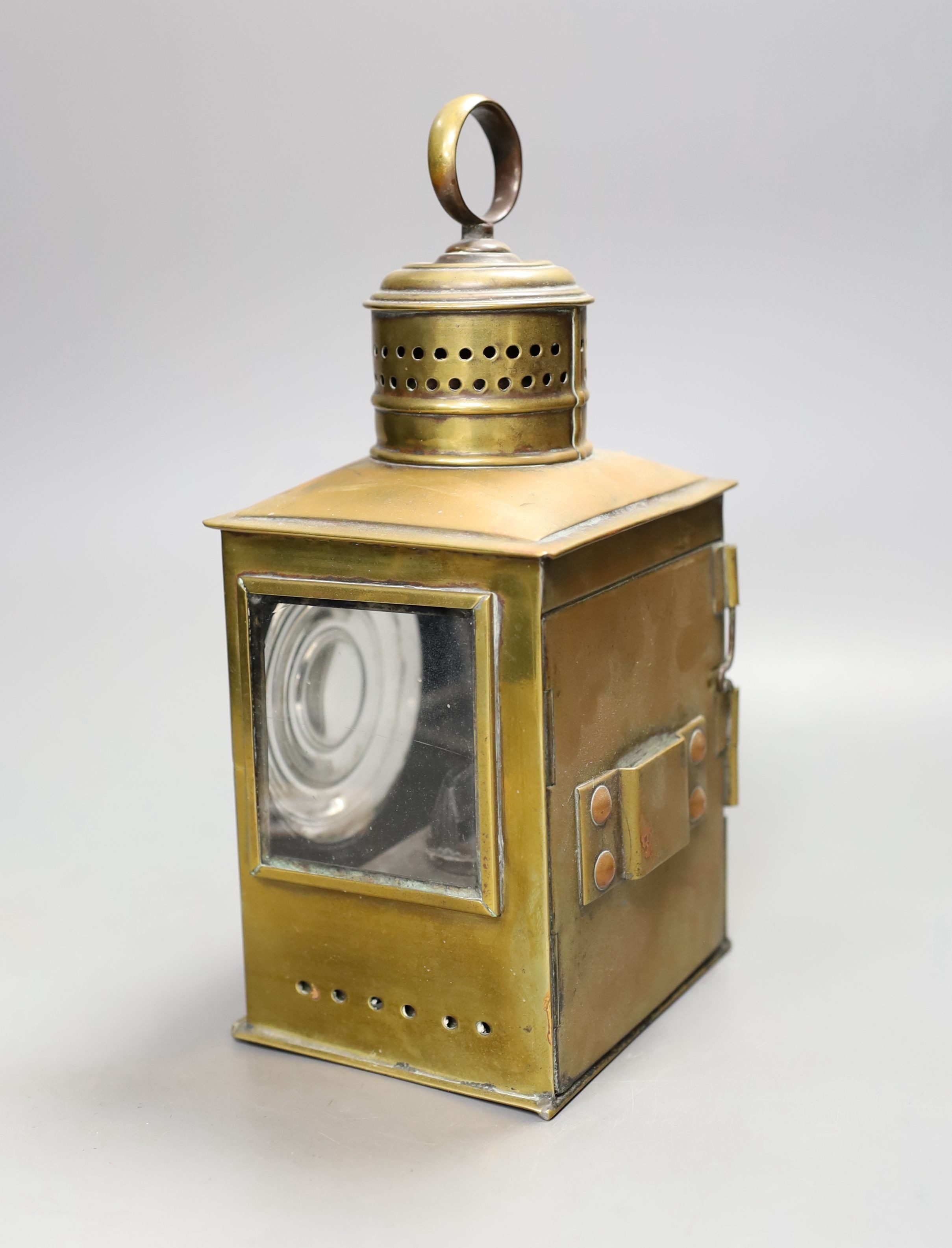A 19th/20th century brass railwayman's lamp, 26 cms high.